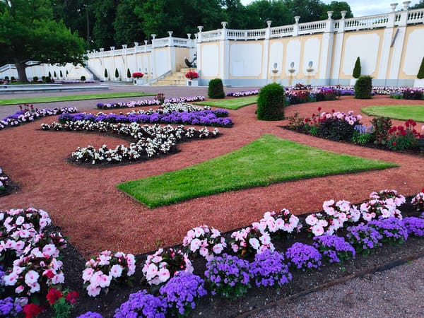 Evening stroll through a formal ornamental garden with fountains