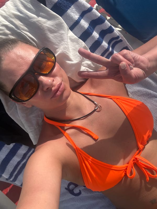 Beach-goer makes peace sign while sunbathing in Egypt