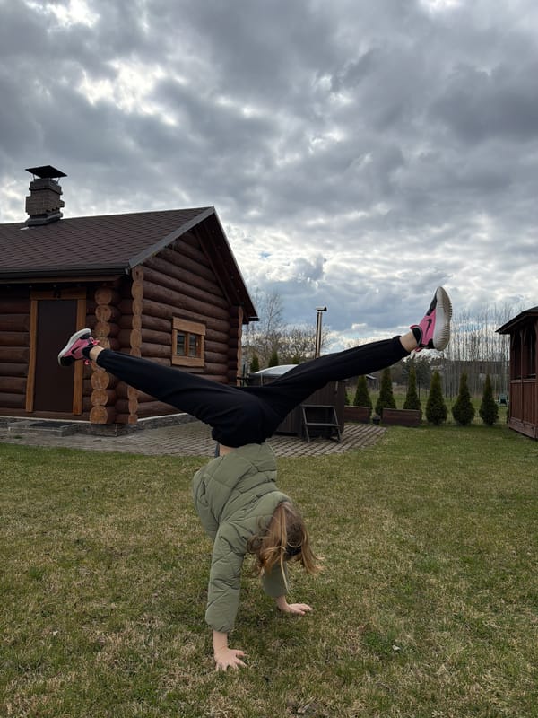 Woman performs handstands, plays badminton in Dreiliņi backyard