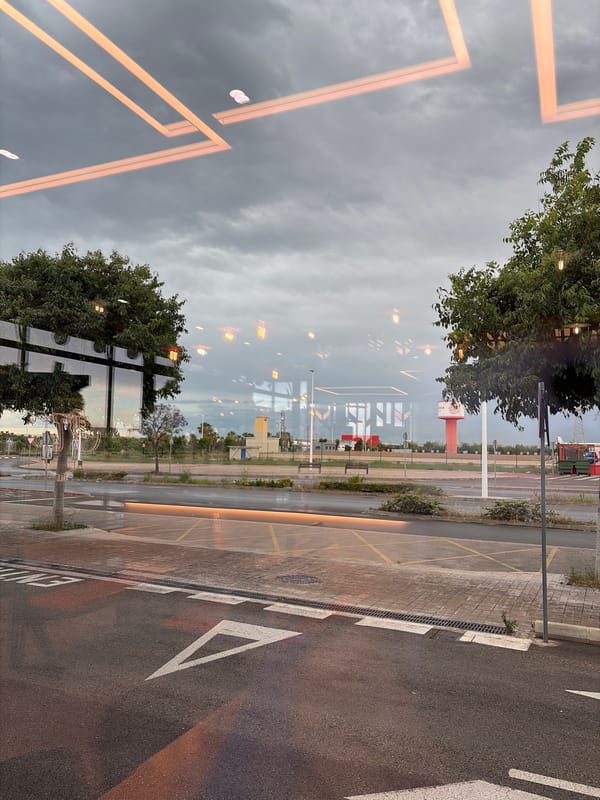 Street scene reflected in glass surface captured in Sagunto