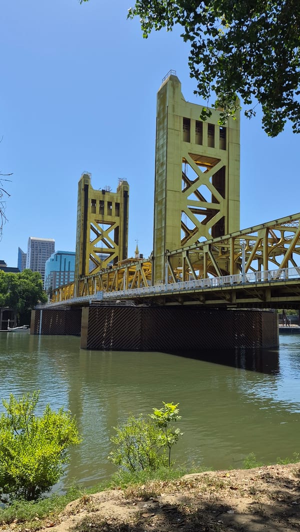 Sacramento's golden Tower Bridge on a clear summer day