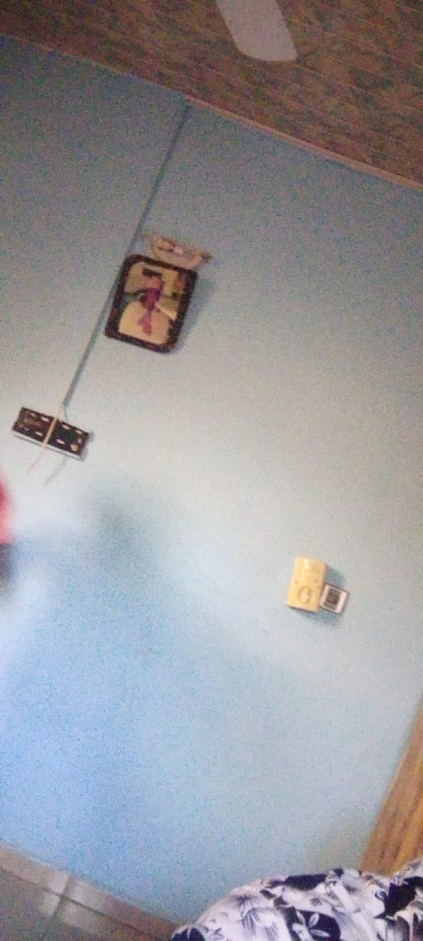 A quiet morning: wall decor and a casual peace-sign selfie