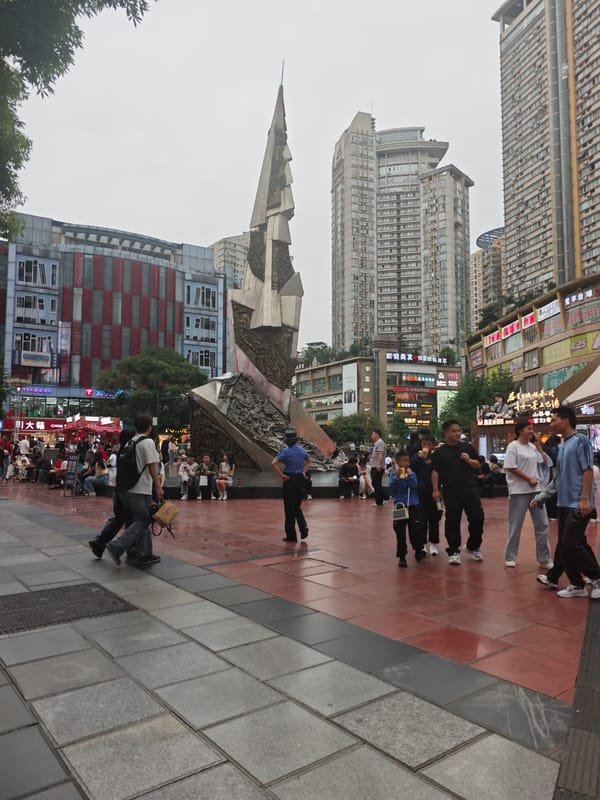 Busy pedestrian square activity documented in Shapingba District, China