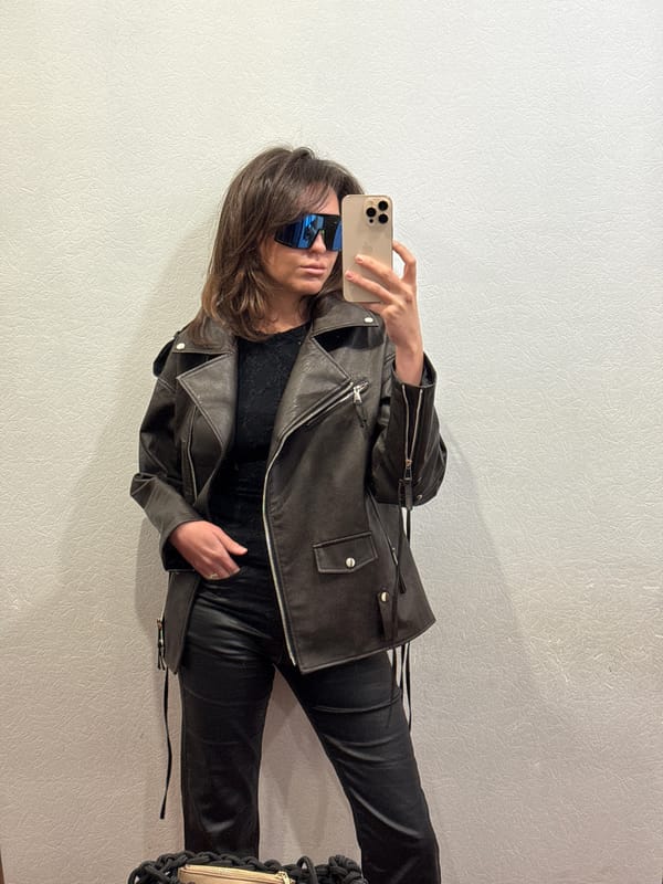 Person takes selfies in leather jacket, Krasnoyarsk