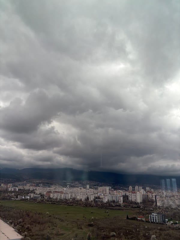 Overcast skies observed over dense Sofia cityscape from elevation