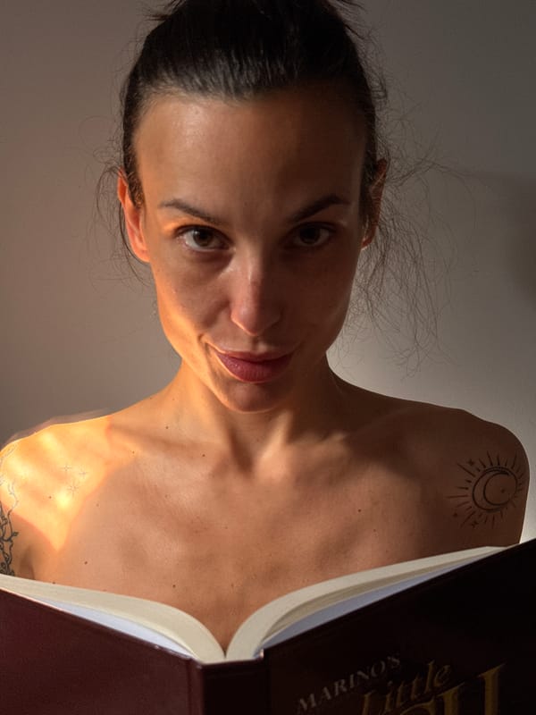 Woman reading, photographed through glass container in Pleven, Bulgaria