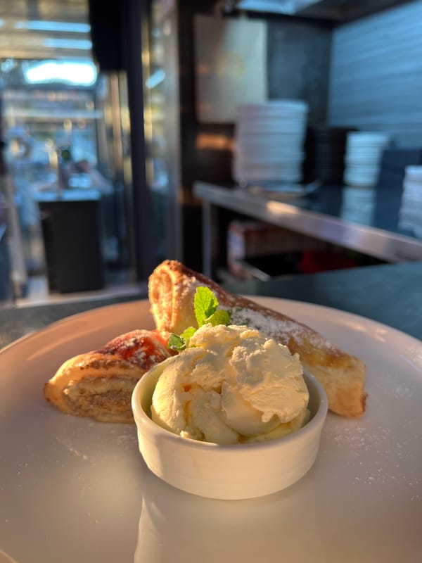 Restaurant patron enjoys dessert in Budva, Montenegro