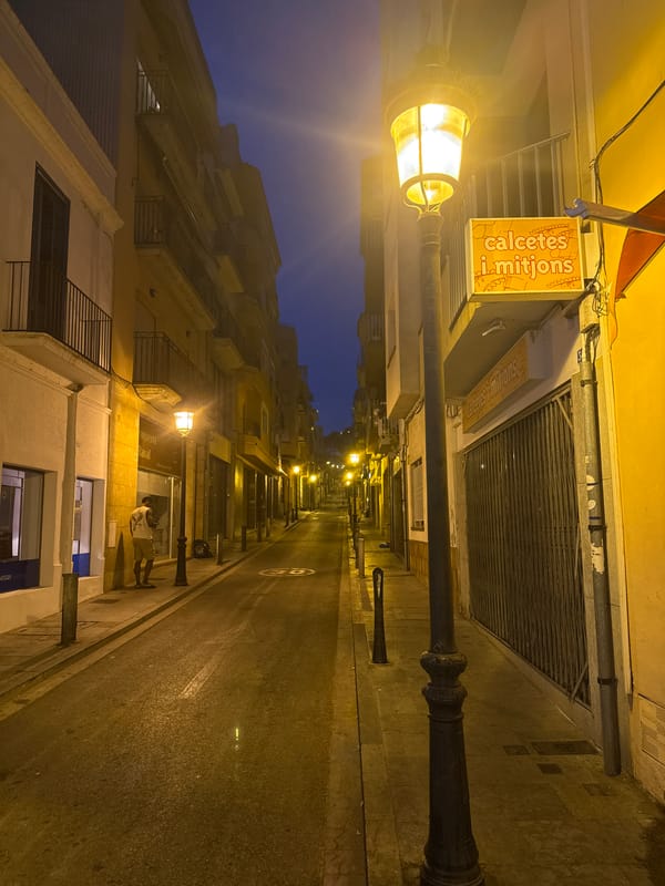 Blanes at night: streets, moonrise, and seaside calm
