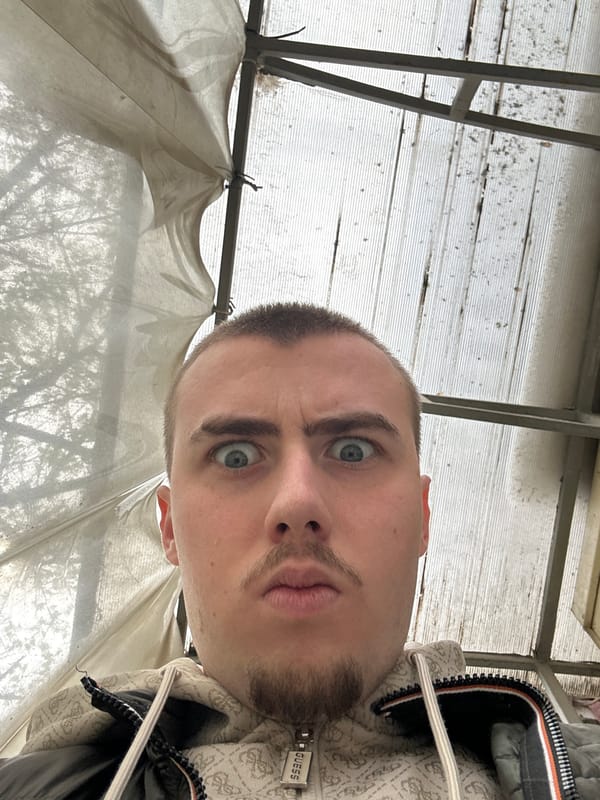 Man takes selfie in Sofia wearing Guess hoodie