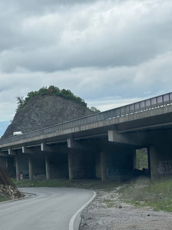 Concrete bridge structure observed spanning roadway near Malo Buchino