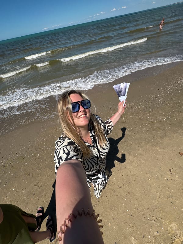 Woman documents sunny morning beach visit in Anapa, Russia