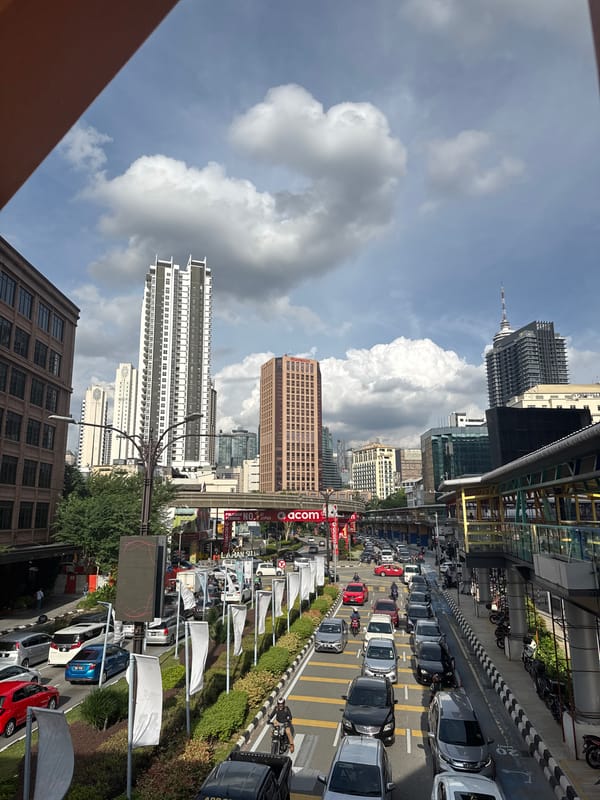 A KL morning: city streets, tourist buses, and supermarket aisles
