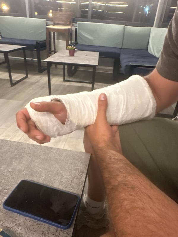 Person with arm cast observed in seated position