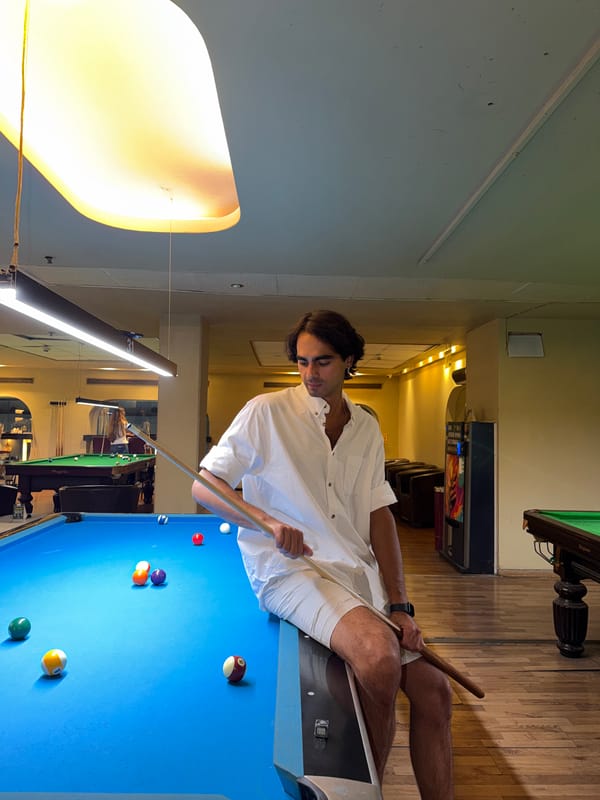 Pool game in progress at a Tel Aviv billiards hall