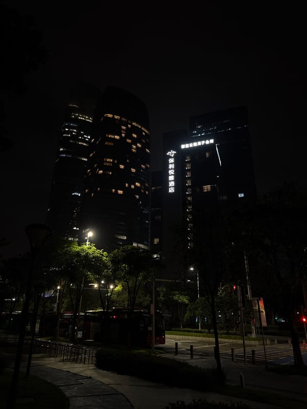Haizhu District waterfront and streets on a wet June night