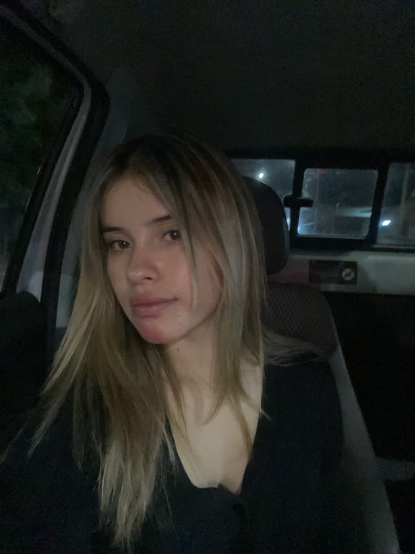 Woman smiles from car window in Catamarca, Argentina