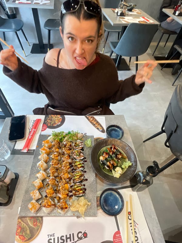 London diner enjoys sushi meal, poses with chopsticks
