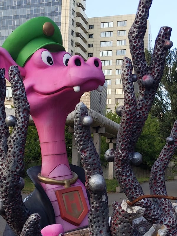 Pink dragon statues in military gear on display in Kyiv
