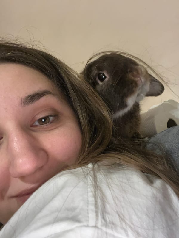 Woman poses for selfies with pet rabbit in Sofia