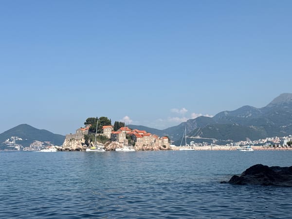 Morning on the water around Sveti Stefan's iconic island coastline