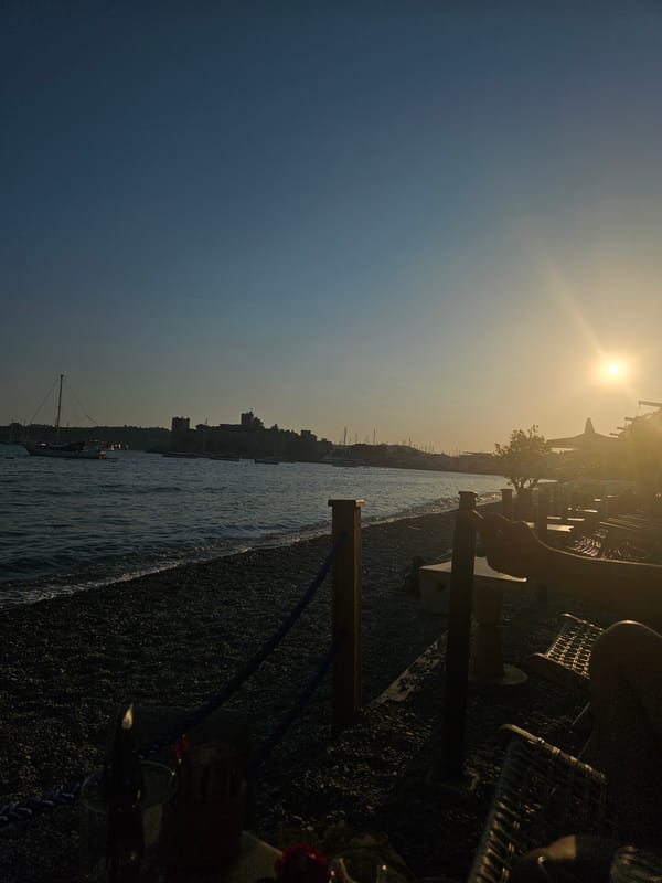Sunset hour on a Bodrum pebble beach, Aegean in view