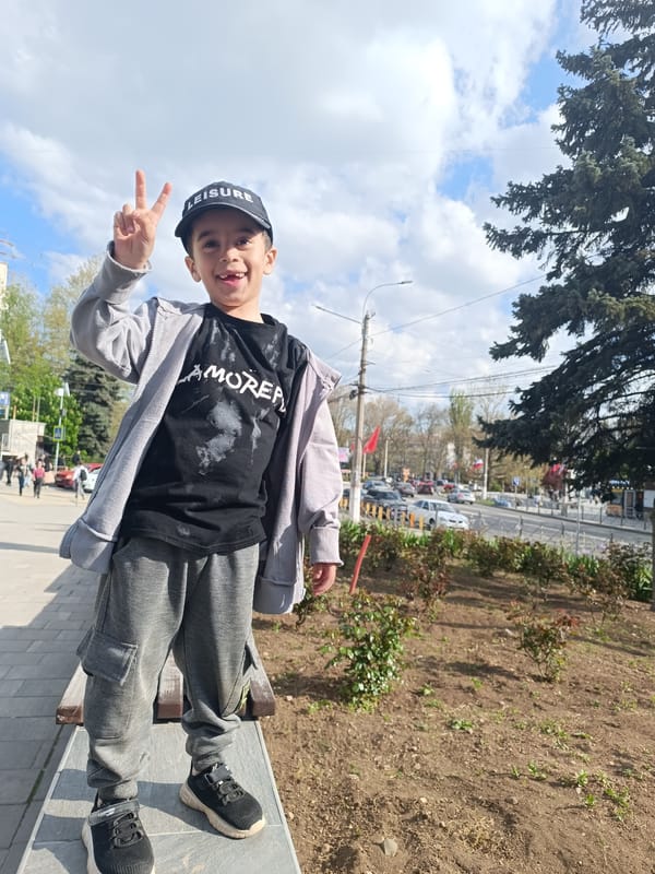 Woman and boy pose for outdoor photo in Simferopol
