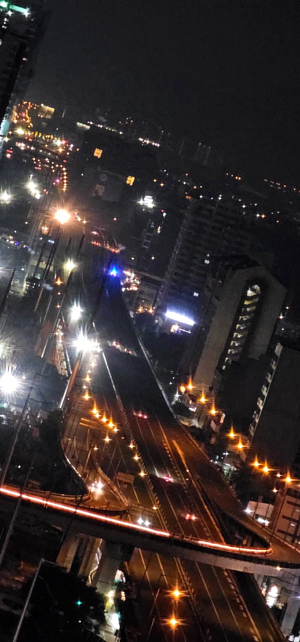 Makati elevated interchange glowing with nighttime traffic