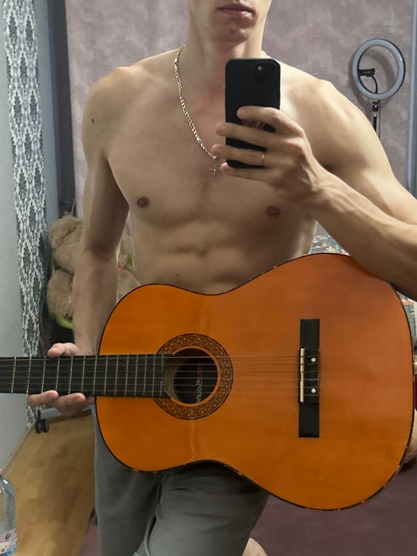 Guitar session and room details in Toruń, evening light