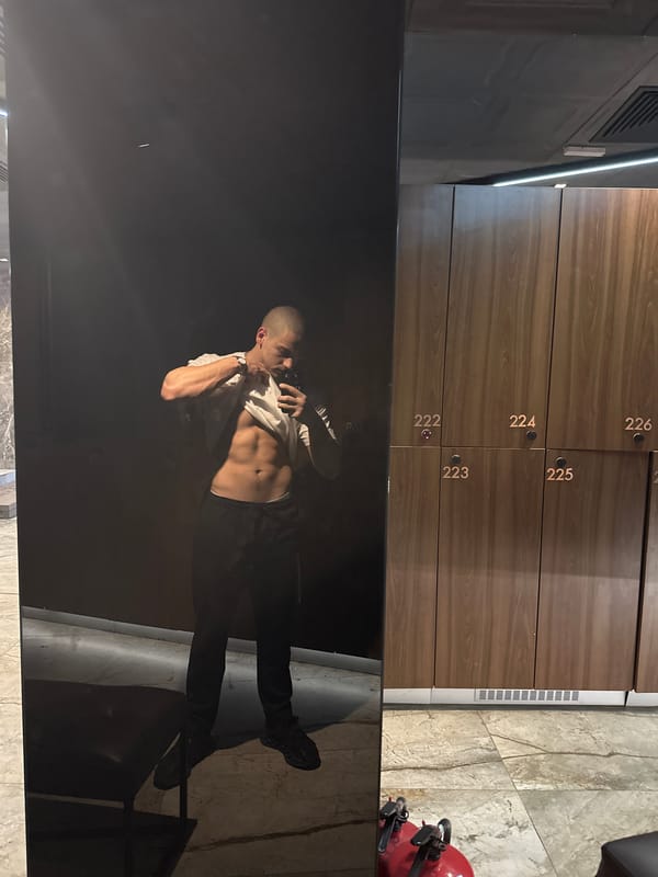 Man Takes Selfie in Numbered Locker Room Facility