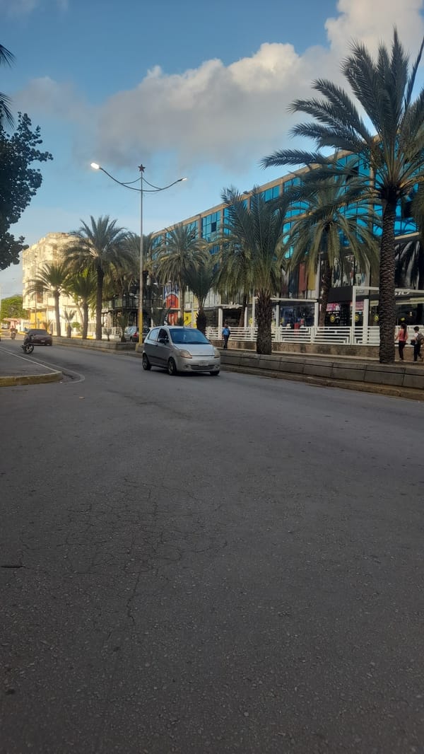 Midday street traffic and foot activity in Juan Griego, Venezuela