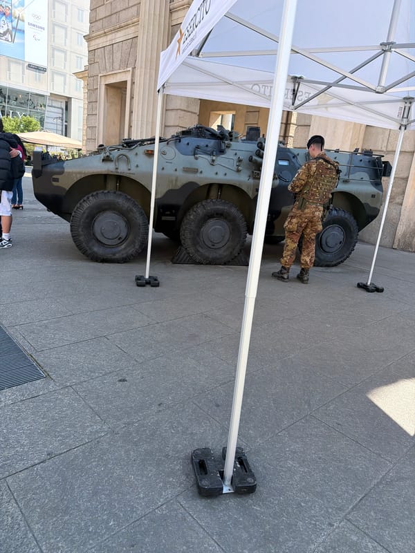 Military vehicle display with soldier observed in Milan