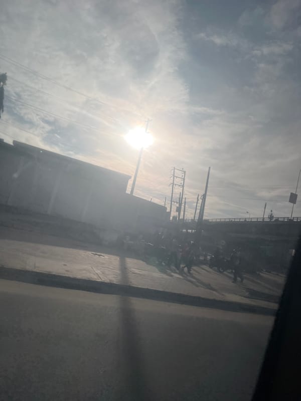 Morning street scene shows parked motorbikes in Dar es-Salaam