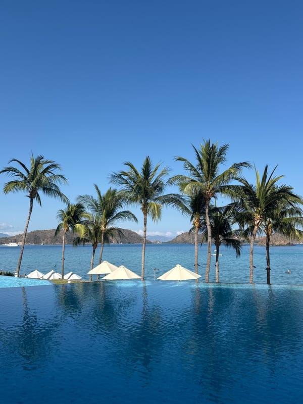 Labuan Bajo bay views, resort grounds, and evacuation signage