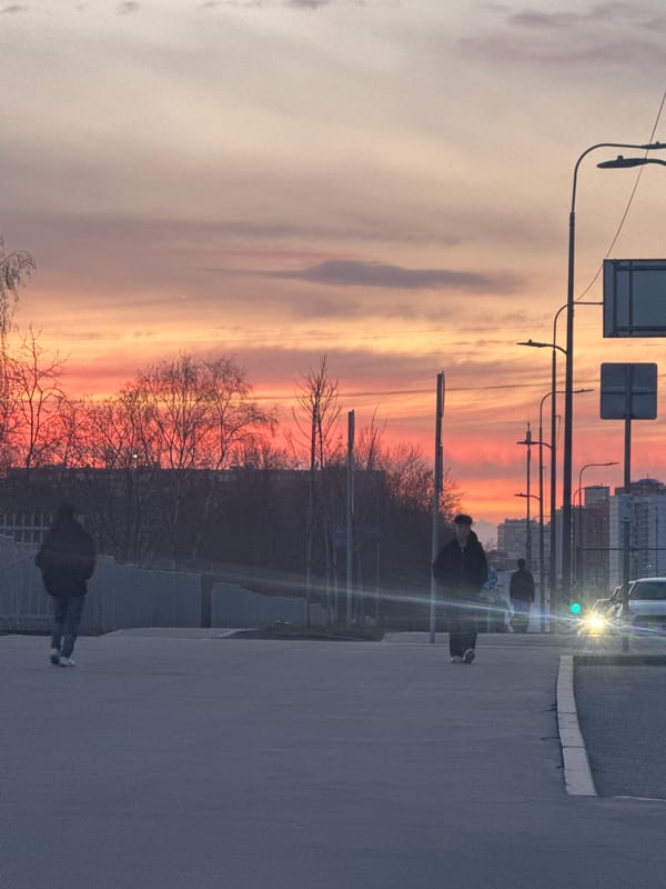 Sunset observed over Moscow street with colorful sky display