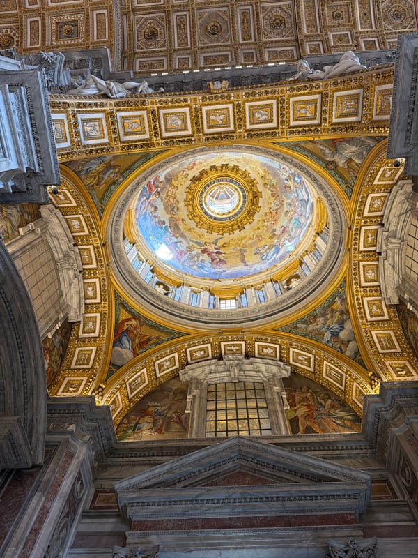 Visitor photographs St. Peter's Basilica dome frescoes in Vatican City
