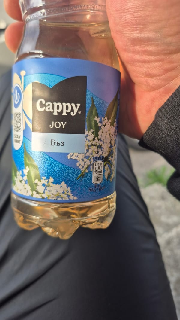 Person holds elderflower drink in Pernik, Bulgaria