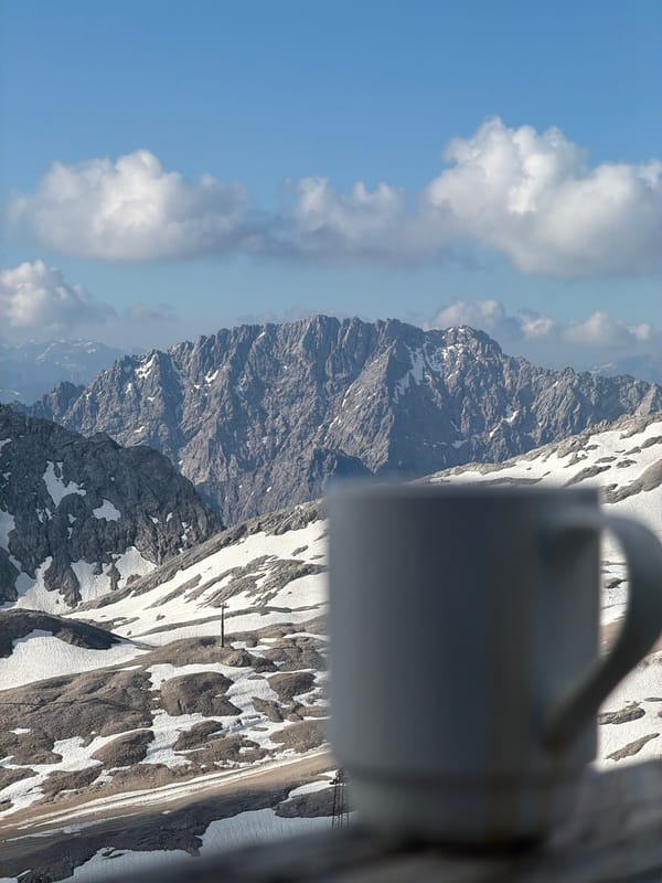 Morning coffee and snow groomers at the Bavarian Alps summit