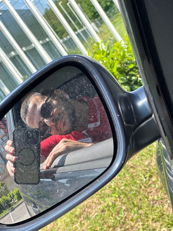 Person captures self-reflection in car mirror in Lovech