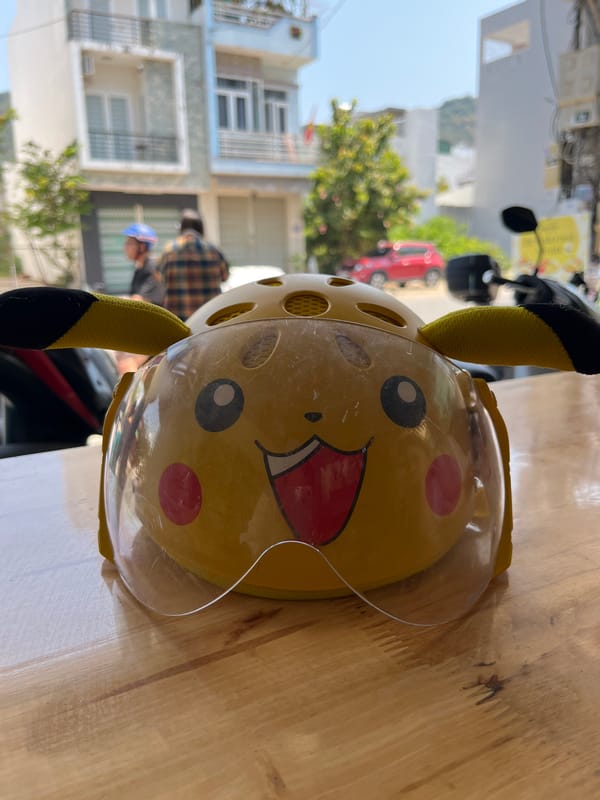 Pikachu bicycle helmet spotted in outdoor café area