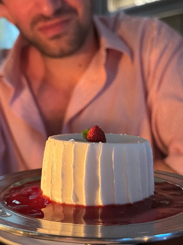 Man enjoys dessert at Milan cafe