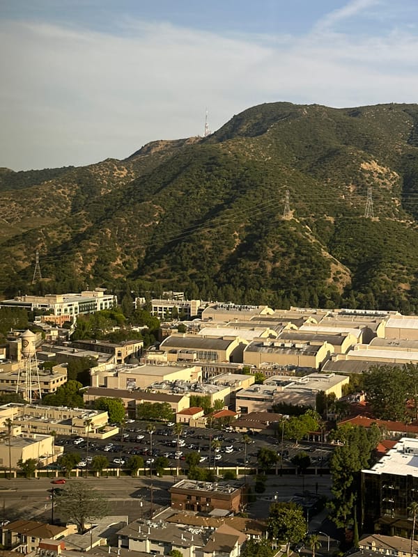 Aerial view captured of Burbank cityscape against mountains