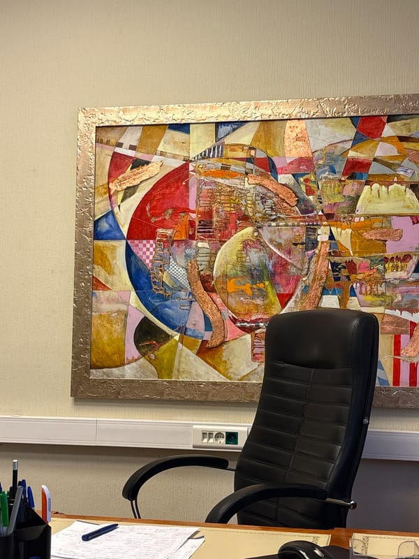 Moscow workspace interior documented with printer and abstract art