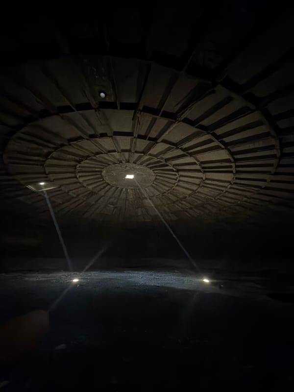 Visitor documents circular architecture at Tbilisi History Museum